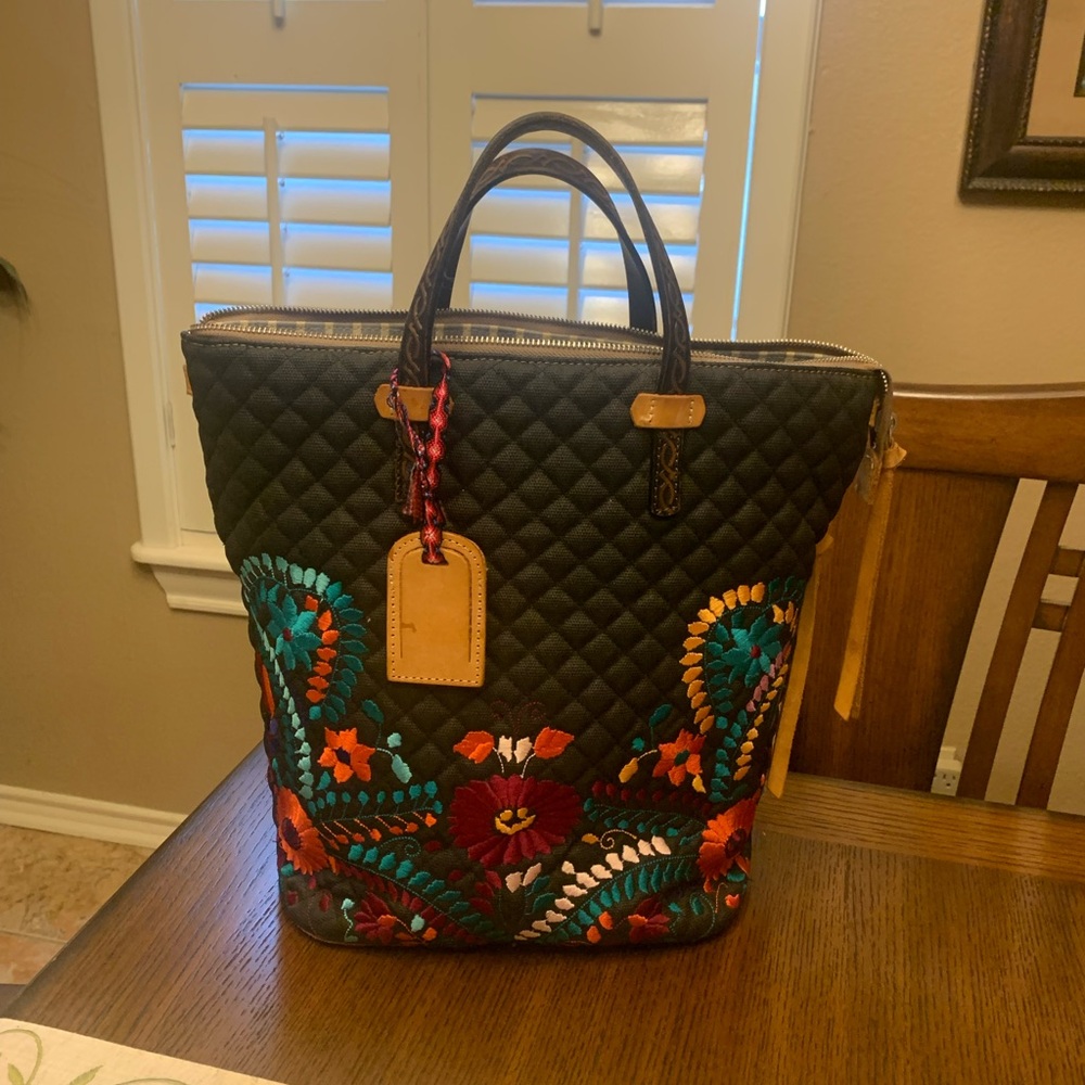 Selling a beautiful Black with multi-color Consuelo handbag